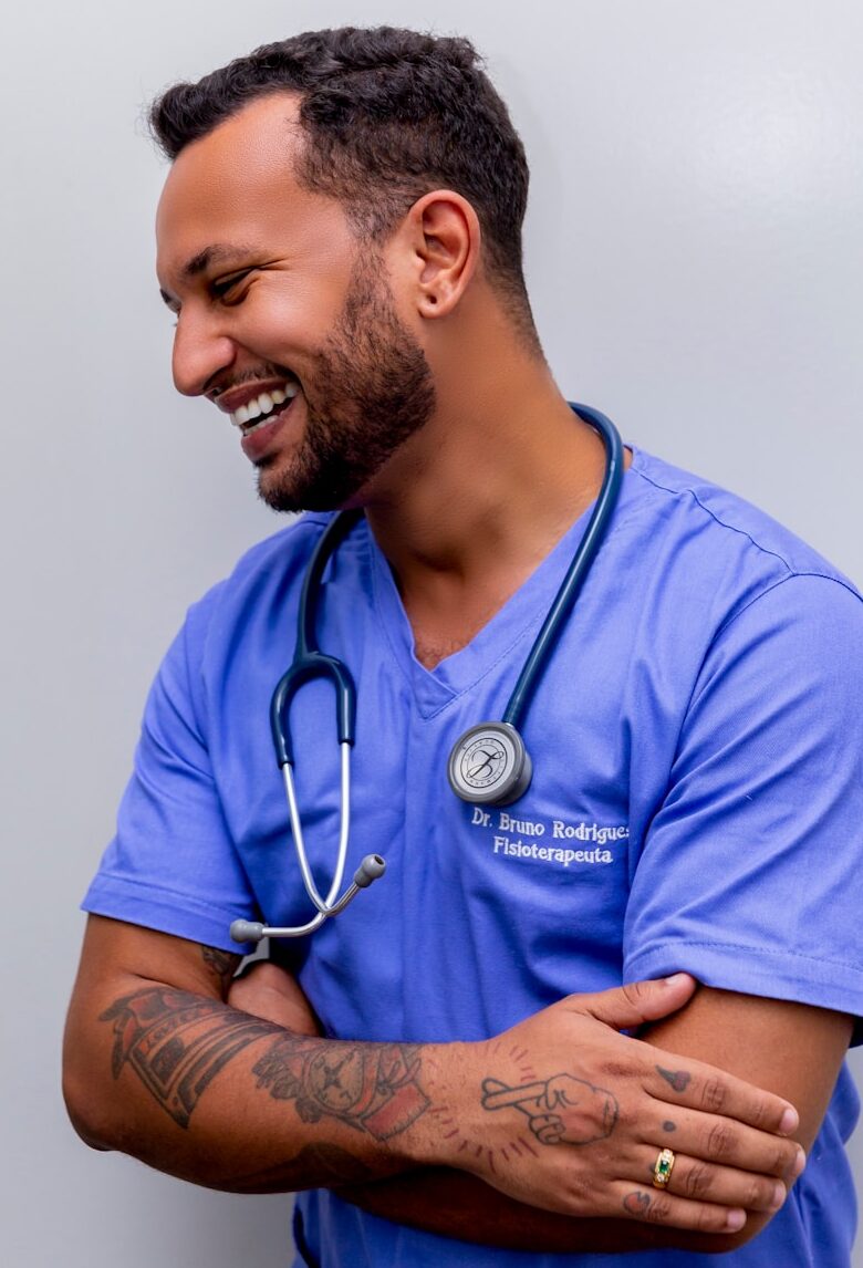 man in blue scrub suit wearing blue stethoscope